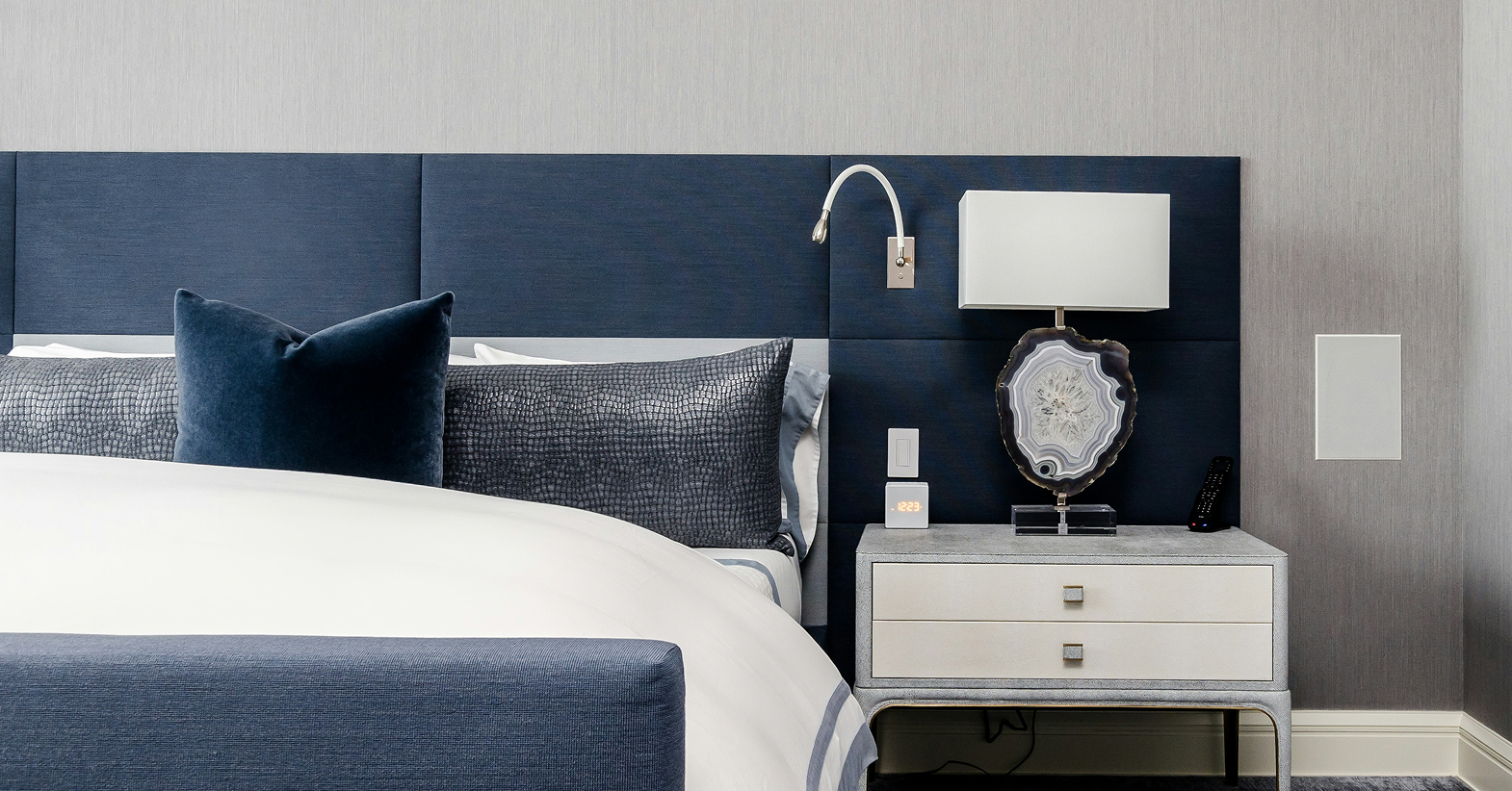 Large scale headboard in a bedroom
