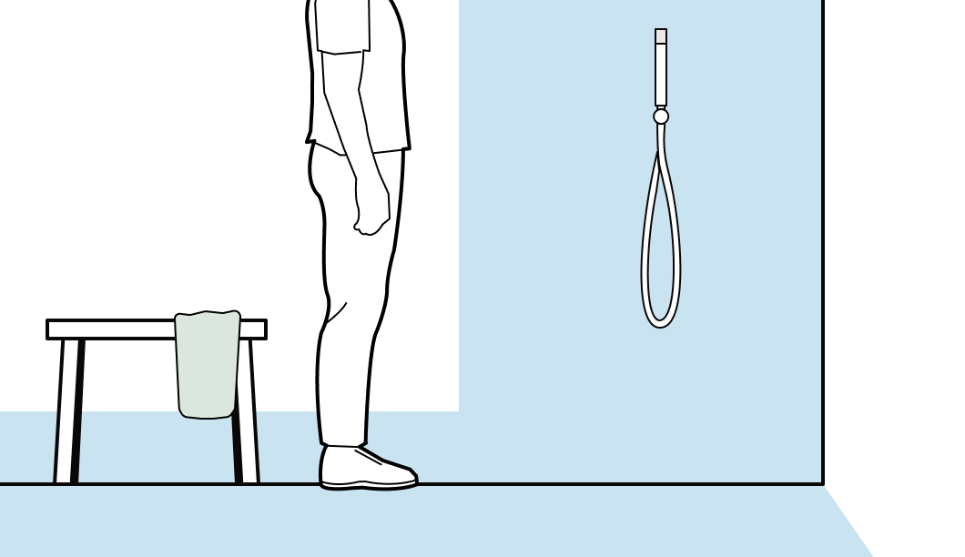 A shower in a wet room, with highlighted blue waterproofing areas on the wall and floor.